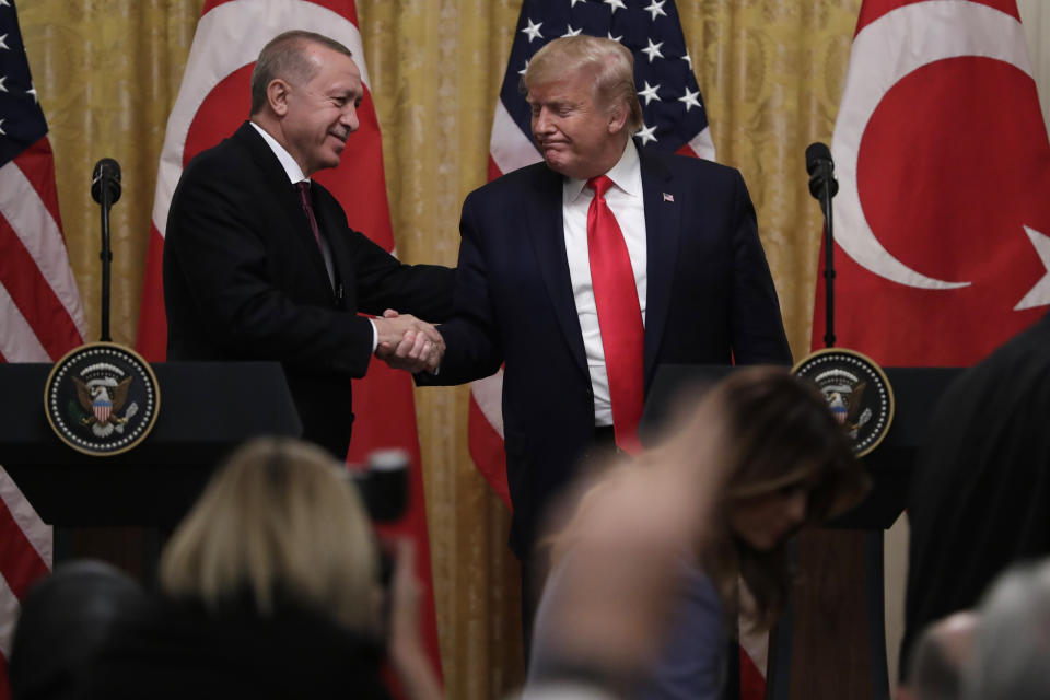 President Donald Trump shakes hands with Turkish President Recep Tayyip Erdogan after a news conference in the East Room of the White House, Wednesday, Nov. 13, 2019, in Washington. (AP Photo/ Evan Vucci)