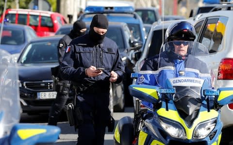 Gendarmes of the French special unit GIGN are seen next to a supermarket after a hostage situation in Trebes - Credit: REGIS DUVIGNAU /Reuters