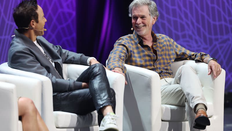 Utah Jazz owner Ryan Smith and Reed Hastings, founder and executive chairman of Netflix, speak during the eighth annual Silicon Slopes Summit at the Delta Center in Salt Lake City on Wednesday, Sept. 27, 2023.