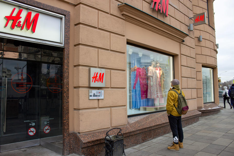 MOSCOW, RUSSIA - 2022/03/05: A man looks at a storefront of the H&amp;M fashion outlet in Moscow. H&amp;M closed its boutiques in Russia in light of the country's military conflict with neighboring Ukraine. (Photo by Vlad Karkov/SOPA Images/LightRocket via Getty Images)