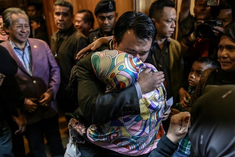 Malaysians freed by Pyongyang made an emotional return Friday after landing at Kuala Lumpur international airport