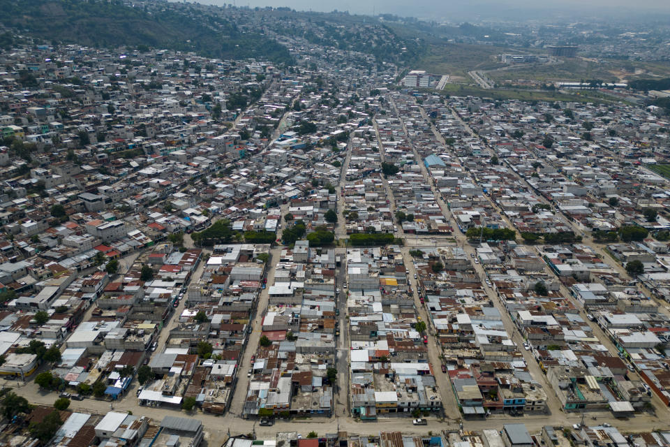 View of the Mario Alioto low-income neighborhood in Villanueva, Guatemala, Tuesday, May 16, 2023. One of the most populated slums in Guatemala with approximately 70 thousand neighbors, the Mario Alioto neighborhood is disputed between rival criminal gangs. (AP Photo/Moises Castillo)