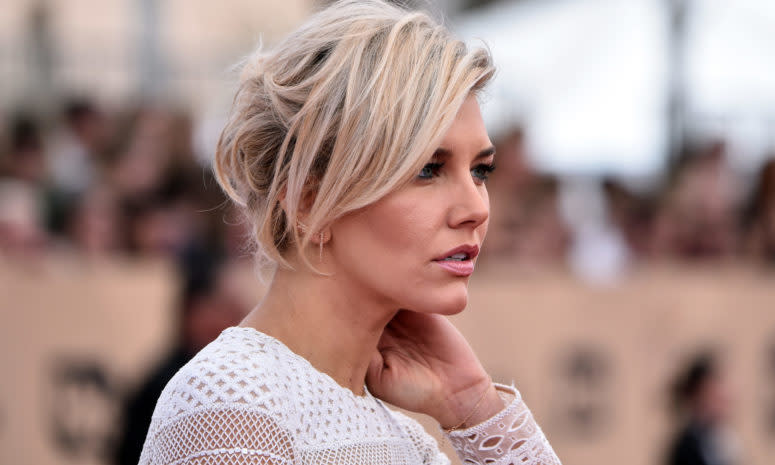 Charissa Thompson walks the red carpet before an awards show.