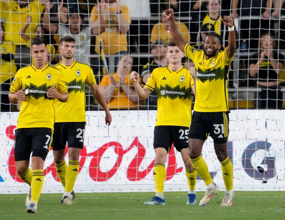 August 21, 2024; Columbus, Ohio, USA; 
Columbus Crew midfielder Sean Zawadzki (25) and Columbus Crew defender Steven Moreira (31) celebrate as the final whistle end a semifinal Leagues Cup match against the Philadelphia Union at Lower.com Field. The Crew won the match 3-1.