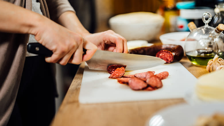 Sausage being sliced