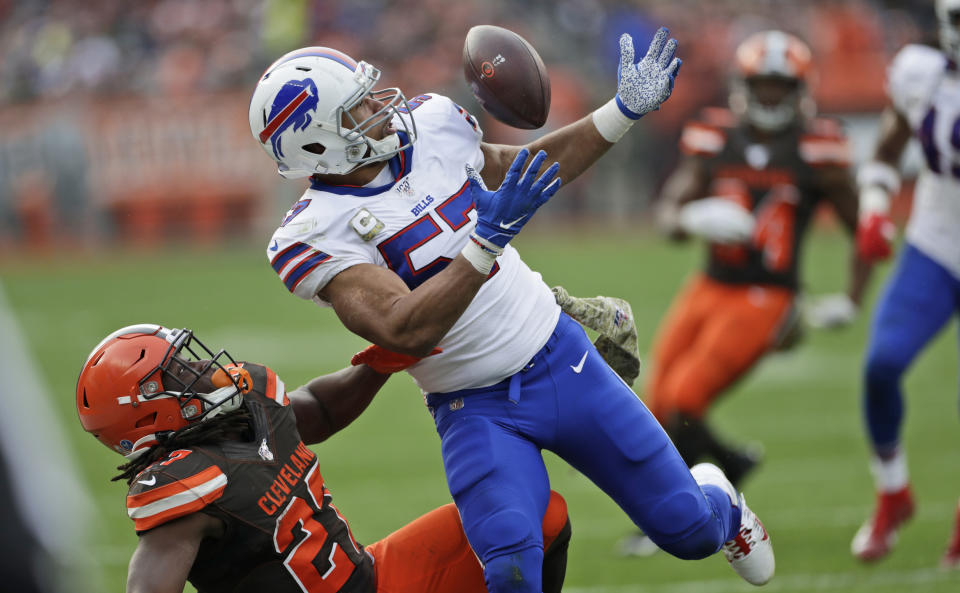 FILE - In this Nov. 10, 2019, file photo Buffalo Bills outside linebacker Lorenzo Alexander (57) breaks up a pass intended for Cleveland Browns running back Kareem Hunt (27) during the second half of an NFL football game in Cleveland. Vowing to retire after this season, the 13-year NFL veteran knows Sunday's regular-season finale against the New York Jets won't be his final game for the playoff-bound Bills. (AP Photo/Ron Schwane, File)