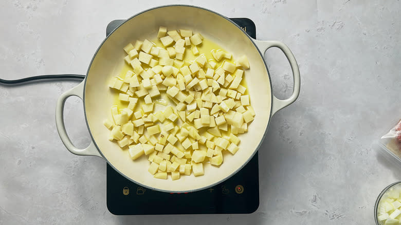 frying potatoes in skillet