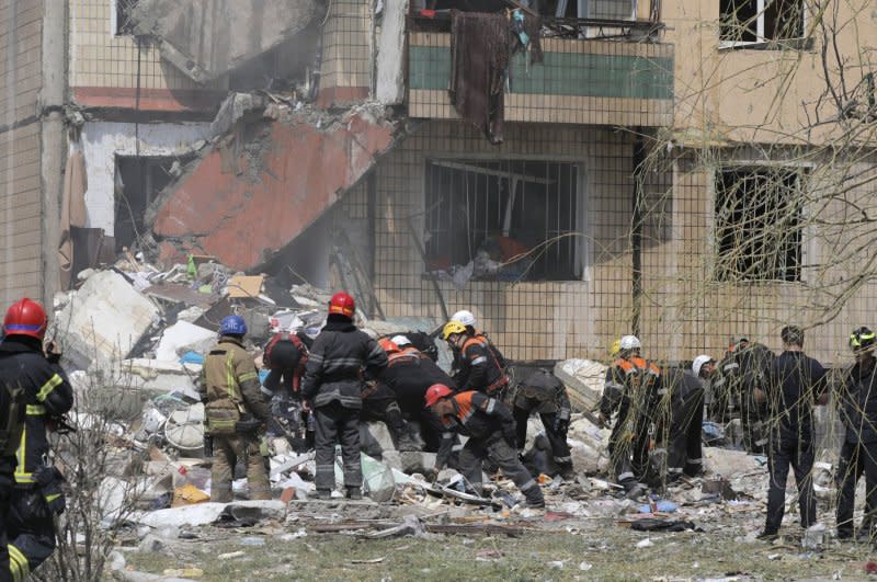 Ukrainian rescuers work at the site of a damaged residential building after shelling in the city of Kryvyi Rih, central Ukraine, on Monday. Photo by Arsen Dzodzaiev/EPA-EFE