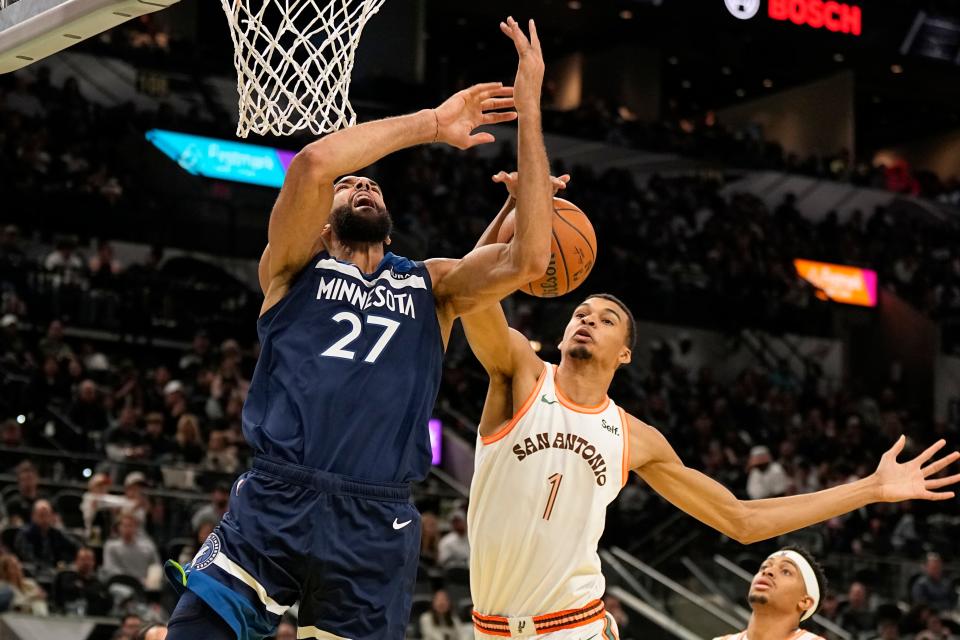Minnesota's Rudy Gobert and San Antonio's Victor Wembanyama battle for a rebound during the second half at Frost Bank Center.