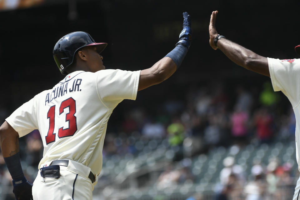 Atlanta Braves' Ronald Acuna Jr. (13) rounds third base on his home run during the first inning of the first game in a baseball doubleheader against the Miami Marlins, Monday, Aug. 13, 2018, in Atlanta. (AP Photo/John Amis)