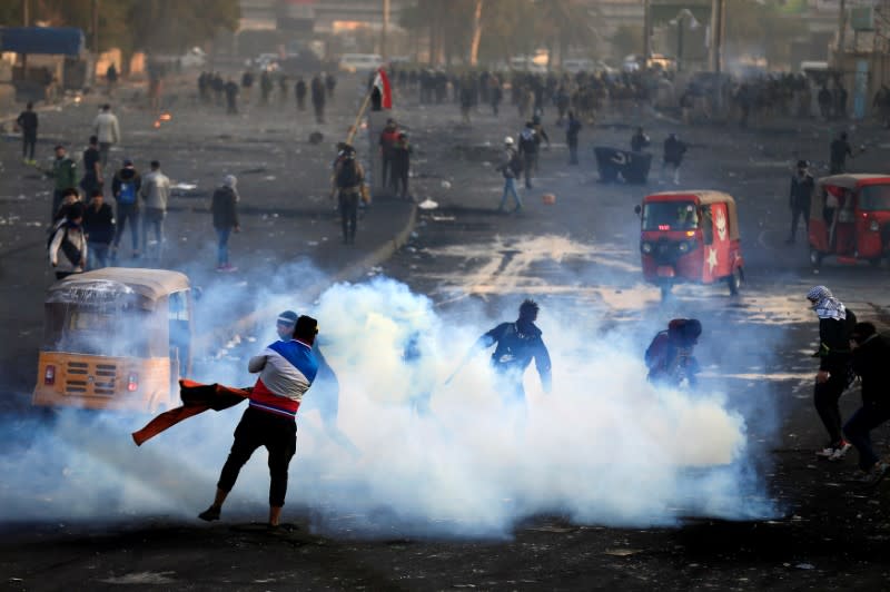 Iraqi demonstrators use tuc-tuc during ongoing anti-government protests in Baghdad