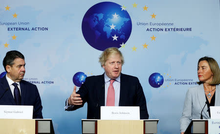 Britain's Foreign Secretary Boris Johnson attends a news conference with German Foreign Minister Sigmar Gabriel and European Union's foreign policy chief Federica Mogherini after meeting Iran's Foreign Minister Mohammad Javad Zarif (unseen) in Brussels, Belgium January 11, 2018. REUTERS/Francois Lenoir