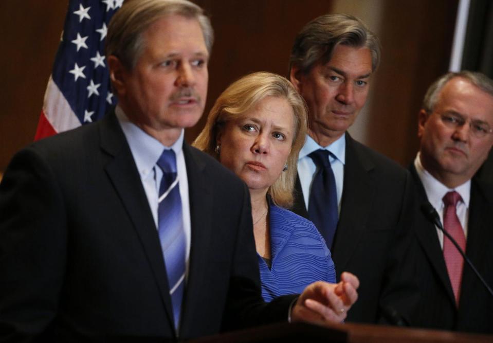 Canada's Ambassador to the US Gary Doer, second right, stands with Sen. Mary Landrieu, D-La., second left, Sen. John Hoeven, R-N.D., left, and American Petroleum Institute (API) President and CEO Jack N. Gerard, right, during a news conference on Capitol Hill in Washington, Tuesday, Feb. 4, 2014, regarding the approval of the Keystone XL pipeline. (AP Photo/Charles Dharapak)