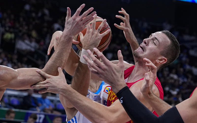Montenegro center Marko Simonovic fights for a rebound against Greece