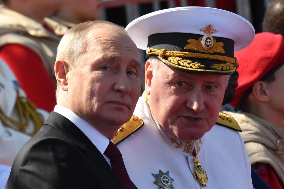 Russian President Vladimir Putin and Commander-in-Chief of the Russian Navy, Admiral Nikolai Yevmenov, attend the Navy Day parade in Saint Petersburg on July 30, 2023.