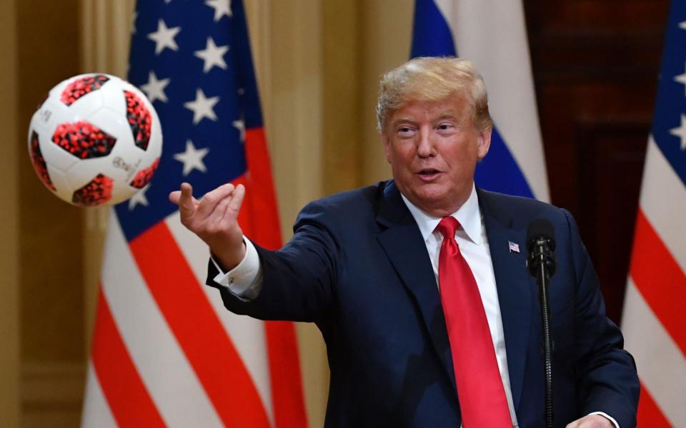 Donald Trump threw the ball to his wife, Melania - AFP PHOTO / Yuri KADOBNOV