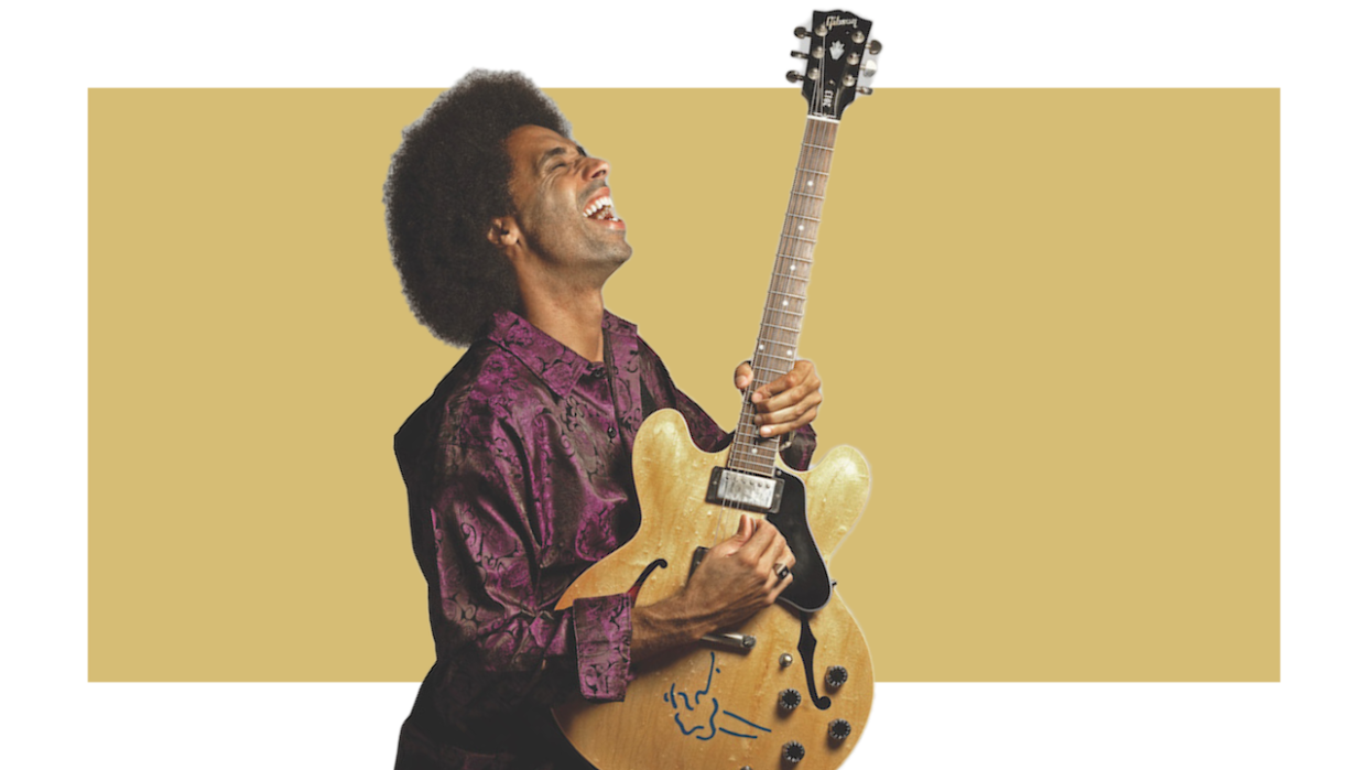  Selwyn Birchwood and a Gibson guitar. 