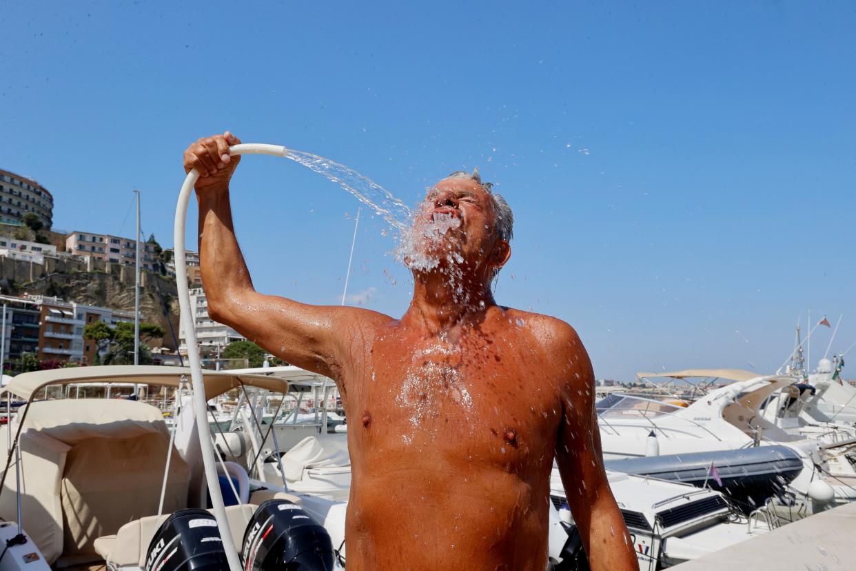 A man cools down in Italy (REUTERS)