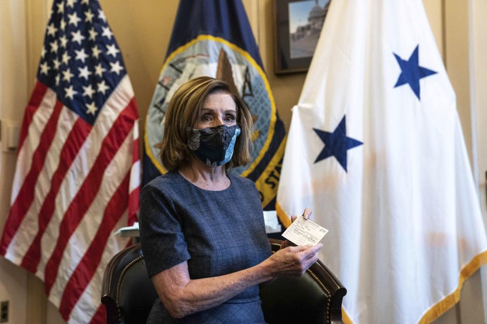 Speaker of the House Nancy Pelosi, D-Calif., sits after receiving a Pfizer-BioNTech COVID-19 vaccine shot in Washington, Friday, Dec. 18, 2020. (Anna Moneymaker/The New York Times via AP, Pool)