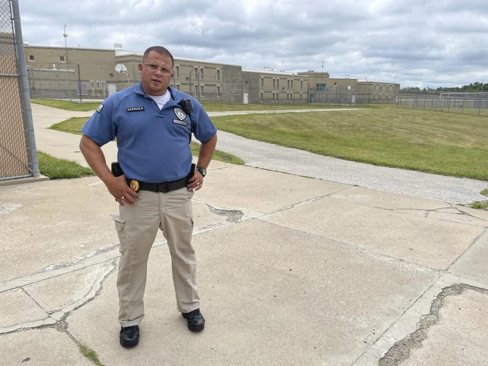 Maj. Albin Narvaez stands in the prison yard of the Fulton Reception and Diagnostic Center, Thursday, July 13, 2023, in Fulton, Mo. Narvaez, who is chief of custody at the prison, said applications for correctional officers have increased since the state implemented a pay raise this spring. (AP Photo/David A. Lieb)