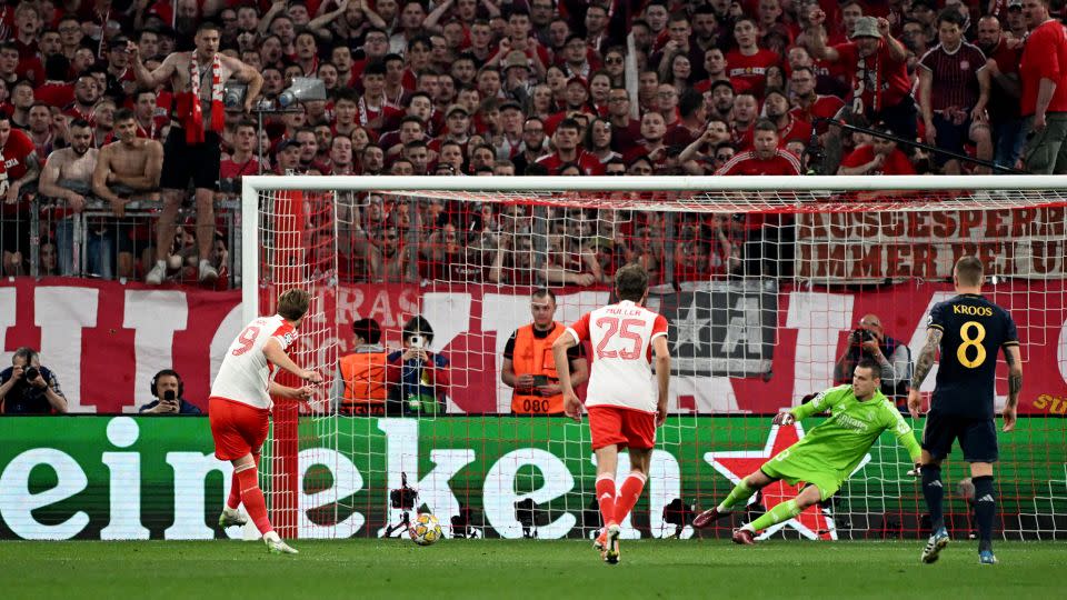 Harry Kane scores a penalty to give Bayern Munich the lead in the game. - Angelika Warmuth/Reuters