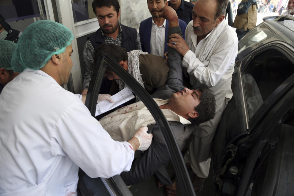 An injured man carried into a hospital after a car bomb explosion in Kabul, Afghanistan, Thursday, Sept. 5, 2019. A car bomb rocked the Afghan capital on Thursday and smoke rose from a part of eastern Kabul near a neighborhood housing the U.S. Embassy, the NATO Resolute Support mission and other diplomatic missions. (AP Photo/Rahmat Gul)