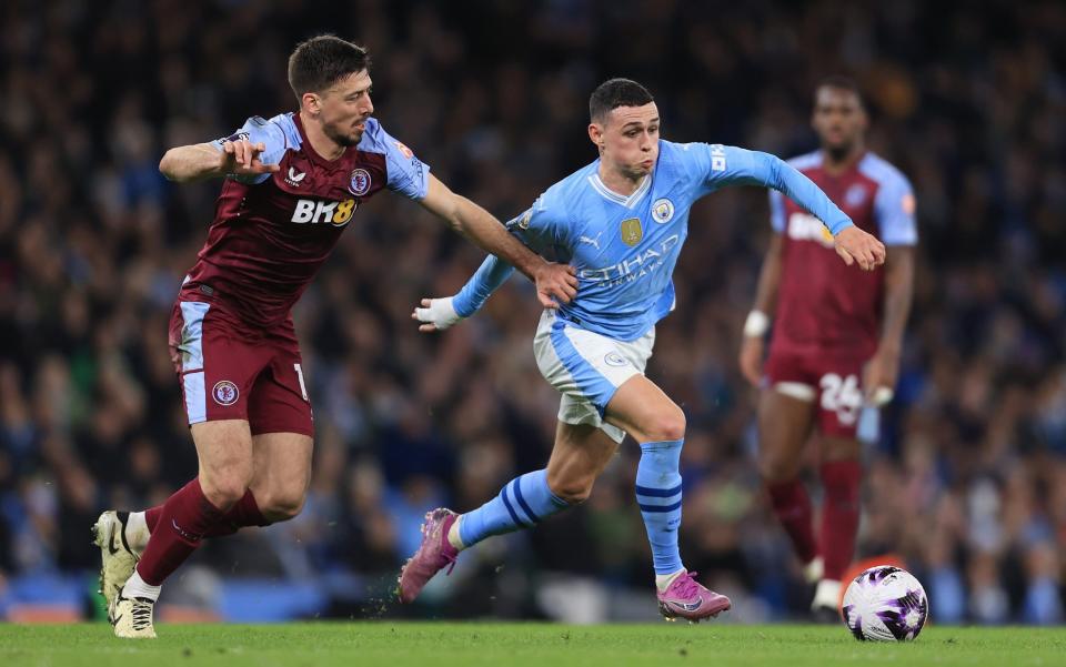 Clement Lenglet of Aston Villa battles with Phil Foden