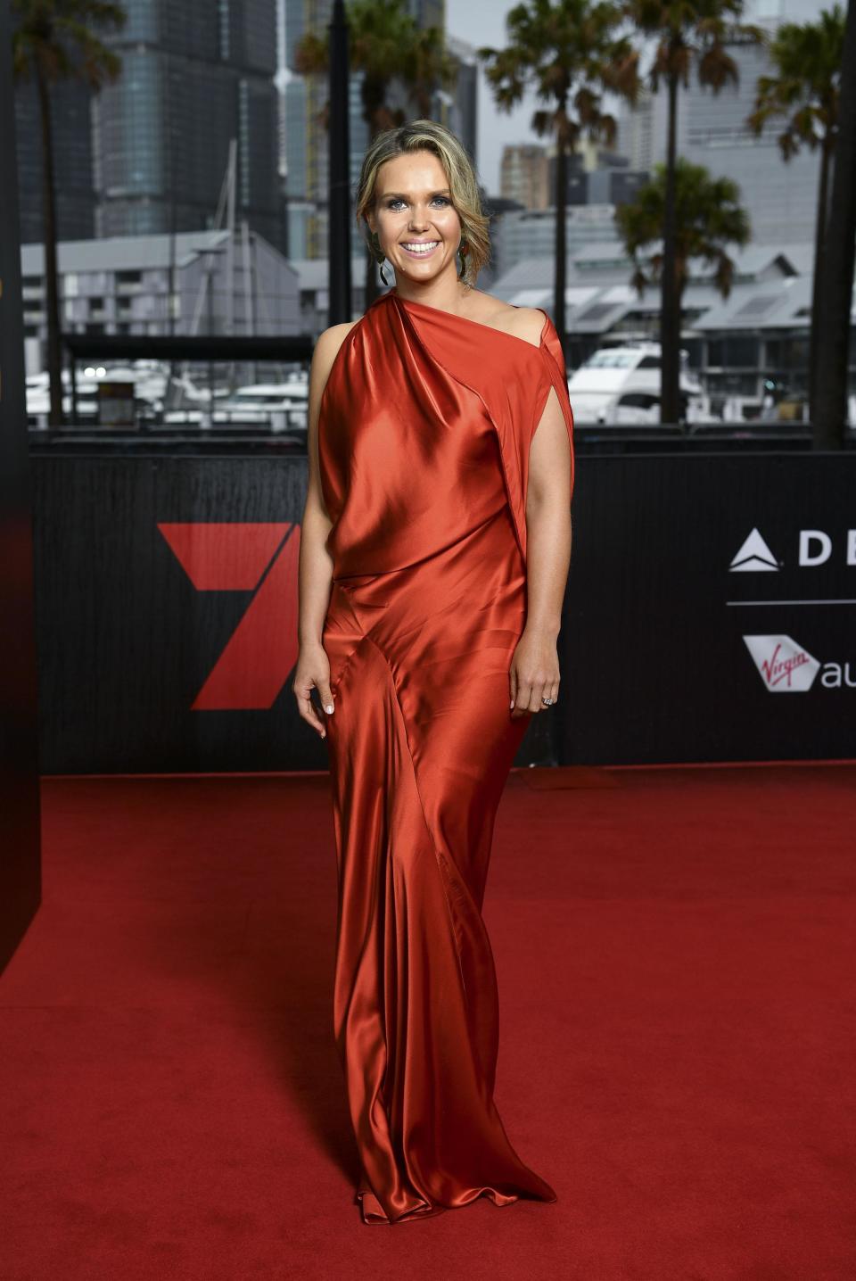 <p>Sunrise weather presenter Edwina Bartholomew brightened up the gloomy afternoon in a loose-fitting scarlet gown.</p>