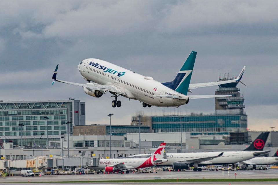 WestJet announced that it has introduced an ultra low-cost fare — and if you like carry-ons, seat choice and earning points, there's a catch.  (Daniel Thomas/CBC - image credit)