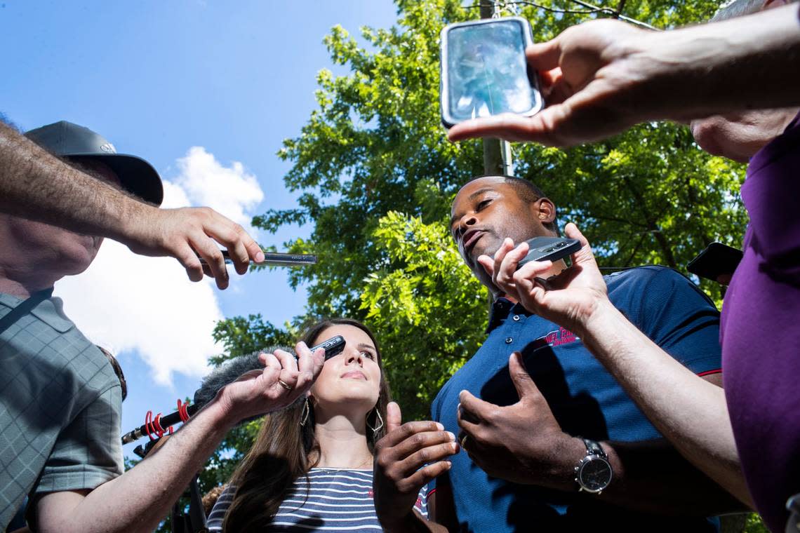 Kentucky Attorney General Daniel Cameron talks with reporters before politicians give speeches during the 142nd annual St. Jerome’s Fancy Farm Picnic in Fancy Farm, Ky., Saturday, August 6, 2022.