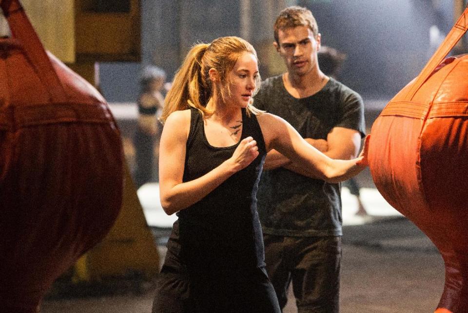 This photo released by Summit Entertainment, LLC shows Shailene Woodley as Beatrice "Tris" Prior, left, and Theo James as Four, in the film, "Divergent." (AP Photo/Summit Entertainment, Jaap Buitendijk)