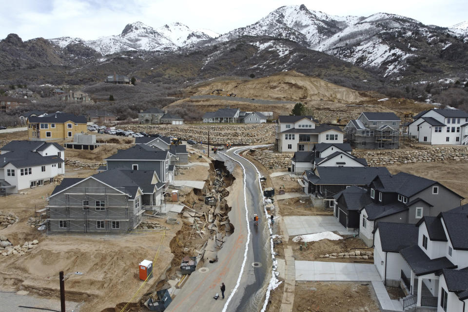 Local officials issued evacuation orders for at least 20 homes as temperatures spiked and snowmelt coursed through the streets on Wednesday, April 12, 2023, in Kaysville, Utah. A record-breaking snow season has raised fears of spring flooding throughout Utah as the weather in mountain regions warms. (AP Photo/Rick Bowmer)