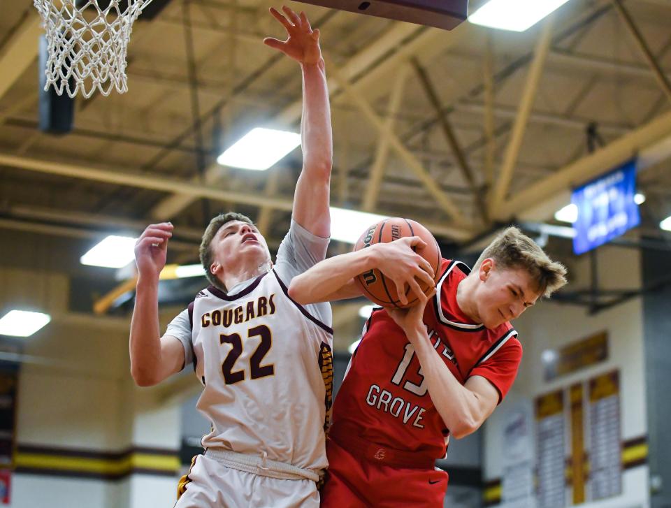 Center Grove’s Peyton Byrd (13) rebounds the ball against Bloomington North’s Luke Lindeman (22) during their IHSAA boys’ basketball sectional semifinal game at Bloomington North on Friday, March 1, 2024.