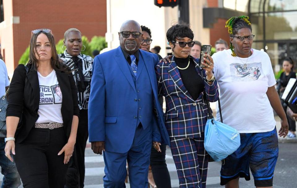 Surrounded by supporters, Cameron Lamb’s parents, Aquil and Laurie Bey, center, leave the Missouri Court of Appeals, Western District, after a hearing Tuesday, Sept. 5, in which Kansas City Police Det. Eric DeValkenaer, is seeking a new trial or to have his conviction overturned in the 2019 shooting death of their son, Cameron Lamb, a Black man. DeValkenaer, who is white, was sentenced to six years in prison after being found guilty of second-degree involuntary manslaughter and armed criminal action in the killing of Lamb on Dec. 3, 2019. Members of Kansas City Law Enforcement Accountability Project (KCLEAP )and Decarcerate KC rallied outside the courthouse and offer support for the Lamb’s family.