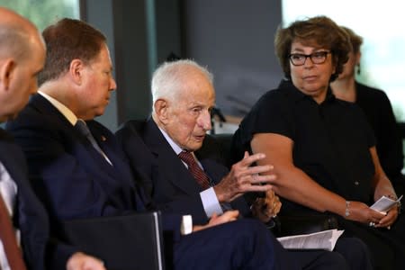 FILE PHOTO: Sylvie Sulitzer listens as former U.S. Attorney Robert Morris Morgenthau speaks during ceremony to return painting by Pierre Auguste Renoir, stolen by Nazis in World War II in New York