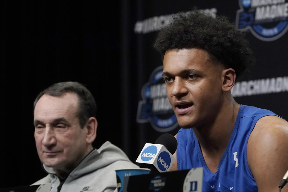 Duke forward Paolo Banchero, right, speaks as coach Mike Krzyzewski listens during a news conference for the NCAA men's college basketball tournament in San Francisco, Friday, March 25, 2022. Duke faces Arkansas in an Elite 8 game Saturday. (AP Photo/Jeff Chiu)