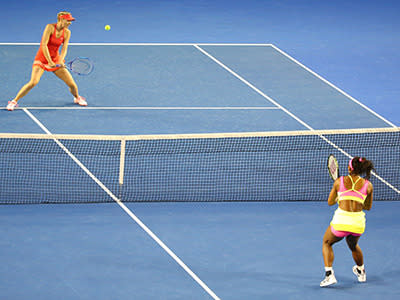 Serena and Maria face-off at the net.