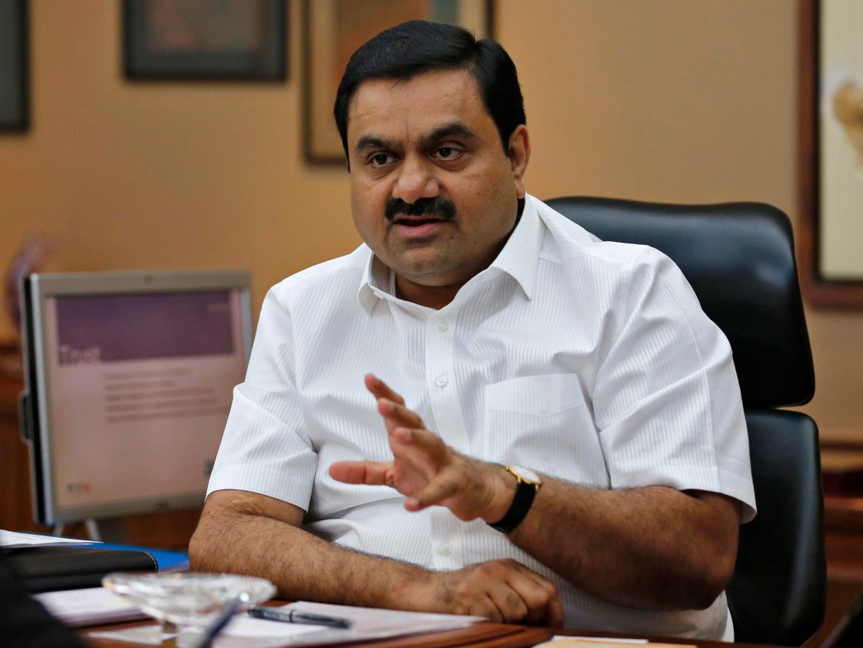 Gautam Adani talking while seated.