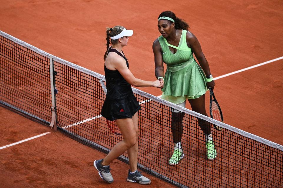 Serena Williams of the US (R) congratulates winner Kazakhstan's Elena Rybakina at the end of their women's singles fourth round tennis match on Day 8 of The Roland Garros 2021 French Open tennis tournament in Paris