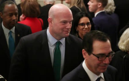 Acting U.S. Attorney General Matthew Whitaker departs between U.S. Treasury Secretary Steven Mnuchin (R) and Housing and Urban Development Secretary Ben Carson (L) after a ceremony where President Donald Trump awarded the 2018 Presidential Medals of Freedom in the East Room of the White House in Washington, U.S. November 16, 2018. REUTERS/Leah Millis