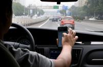 FILE PHOTO: A Didi Chuxing driver on the road in Beijing