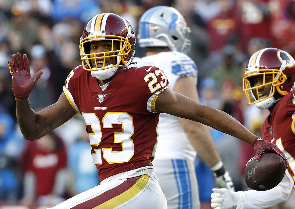 FILE - In this Nov. 24, 2019, file photo, then Washington Redskins cornerback Quinton Dunbar (23) reacts after intercepting a pass from Detroit Lions quarterback Jeff Driskel during the second half of an NFL football game in Landover, Md. Police in South Florida are trying to find New York Giants cornerback DeAndre Baker and Seattle Seahawks cornerback Dunbar after multiple witnesses accused them of an armed robbery at a party. Miramar police issued arrest warrants for both men Thursday, May 14, 2020. (AP Photo/Patrick Semansky, File)