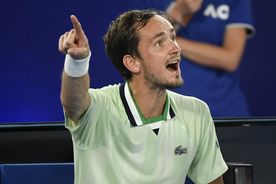 Daniil Medvedev of Russia gestures to chair umpire Jaume Campistol during a break in his semifinal against Stefanos Tsitsipas of Greece at the Australian Open tennis championships in Melbourne, Australia, Friday, Jan. 28, 2022. (AP Photo/Andy Brownbill)