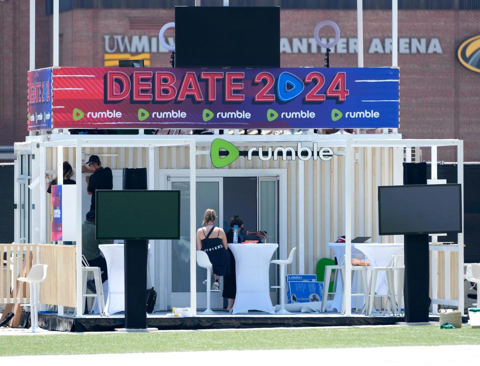 Work is done to setting up the Rumble booth, service streaming the debate, outside Fiserv Forum in preparation for the August 23 Republican presidential debate in Milwaukee on Monday.