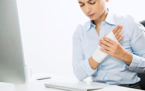 Carpal tunnel can be a real pain for office workers  - Credit: Getty 