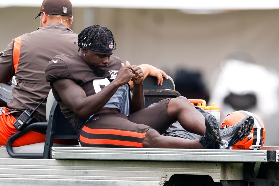 Cleveland Browns wide receiver Jakeem Grant Sr. is carted off the field after getting injured during a drill at the NFL football team's training camp, Tuesday, Aug. 9, 2022, in Berea, Ohio.