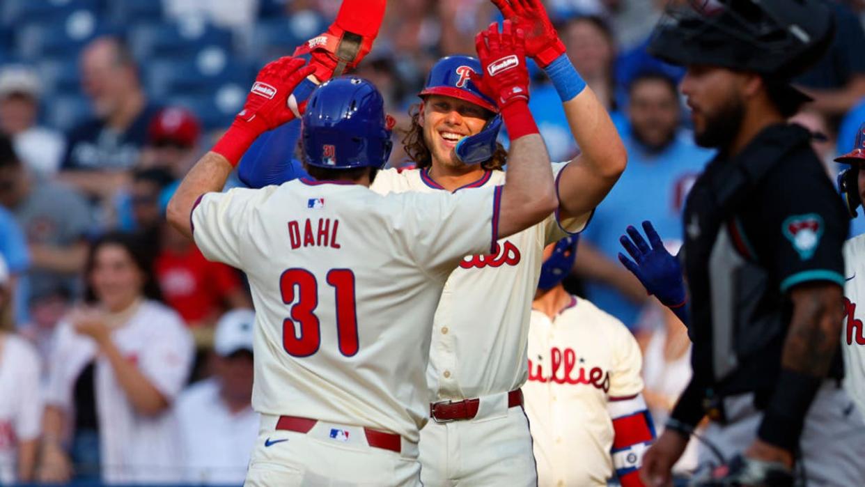 <div>PHILADELPHIA, PENNSYLVANIA - JUNE 22: David Dahl #31 of the Philadelphia Phillies is congratulated by Alec Bohm #28 after hitting a two-run home run against the Arizona Diamondbacks during the eighth inning of a game at Citizens Bank Park on June 22, 2024 in Philadelphia, Pennsylvania. The Phillies defeated the Diamondbacks 12-1. (Photo by Rich Schultz/Getty Images)</div> <strong>((Photo by Rich Schultz/Getty Images))</strong>