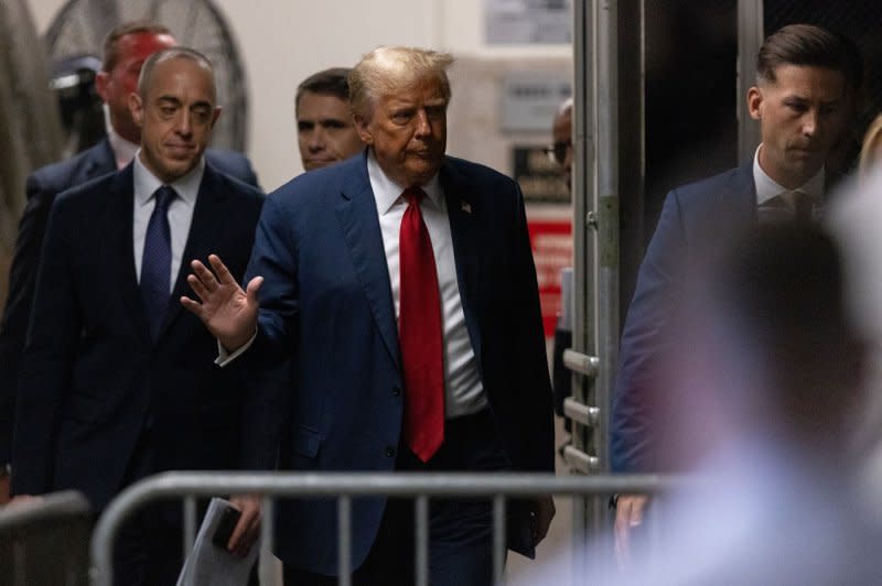 Former President Donald Trump (C) returns to the courtroom after a recess in his criminal trial at Manhattan Criminal Court in New York on Thursday. Pool Photo by Jeenah Moon/UPI