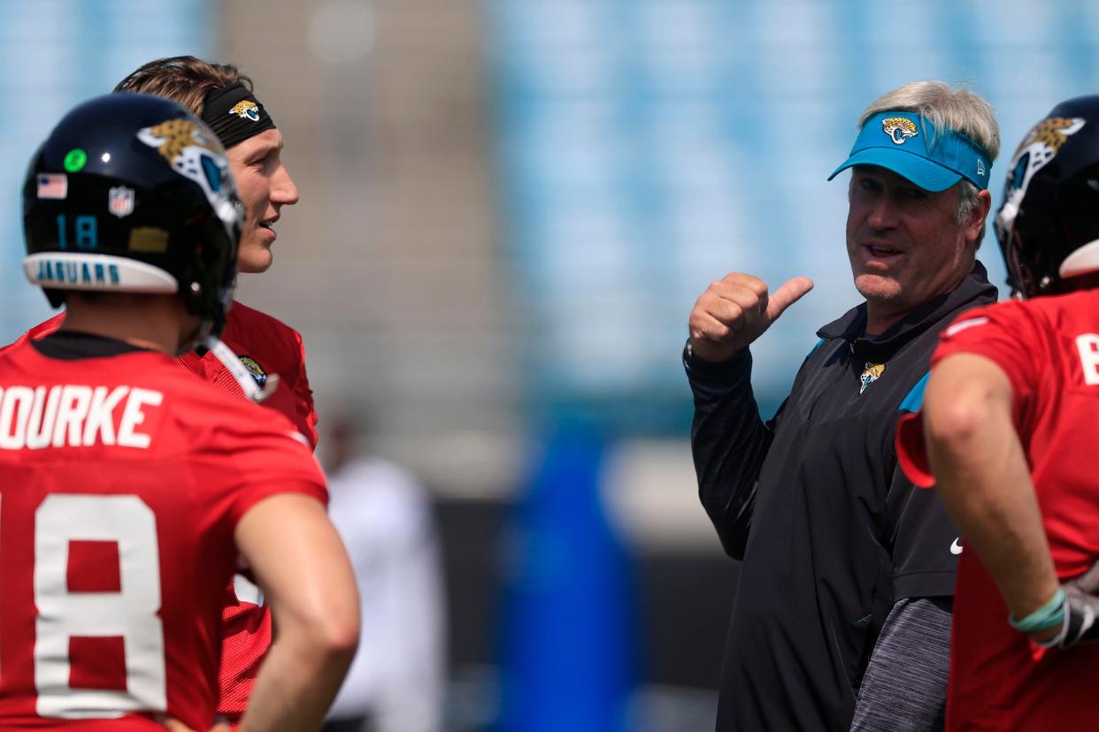 Jacksonville Jaguars quarterback Trevor Lawrence (16) listens to head coach Doug Pederson during an organized team activity Tuesday, May 30, 2023 at TIAA Bank Field in Jacksonville, Fla. 