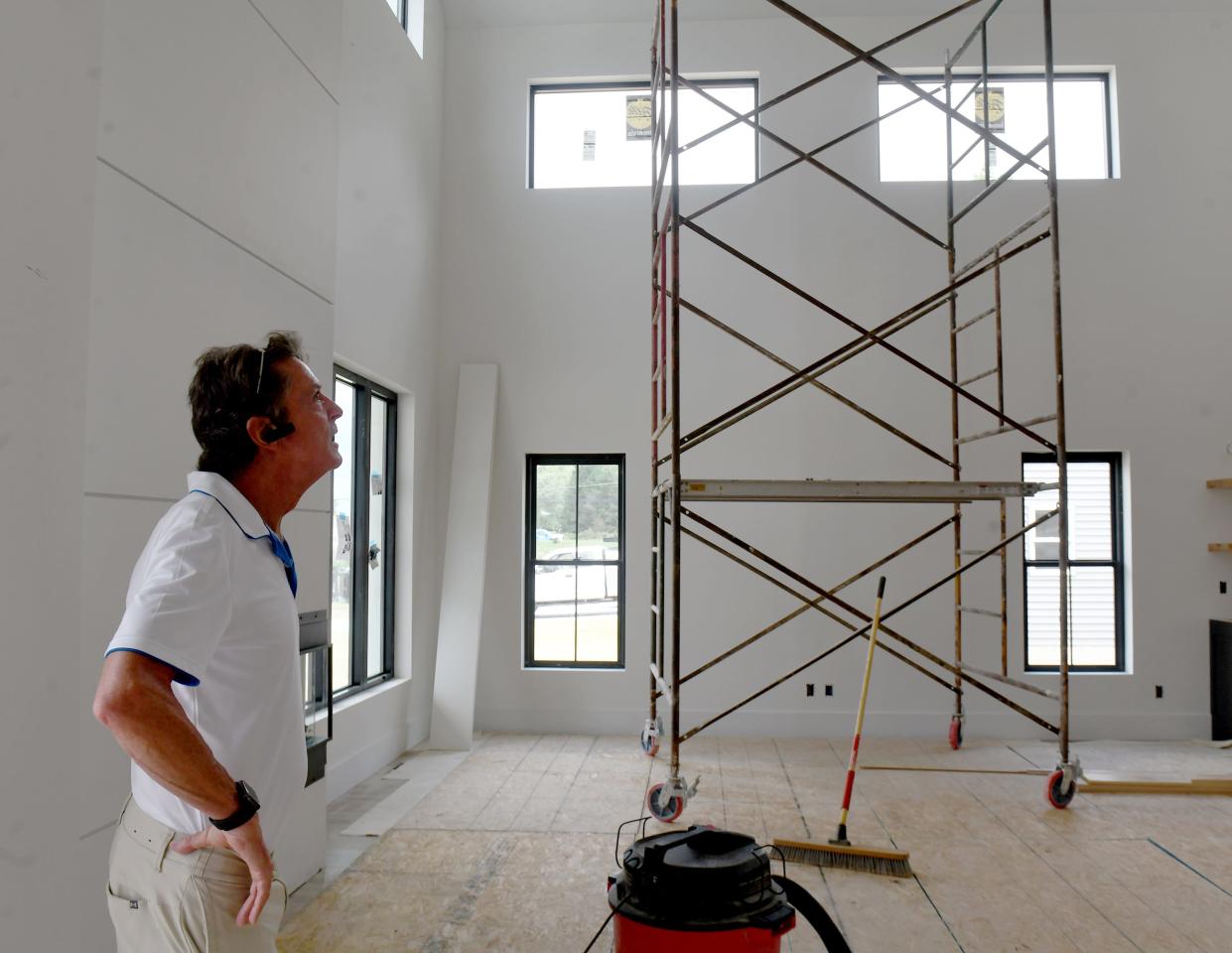 Joe Race looks inside a home by Lawver Homes as the Building Industry Association of Stark & East Central Ohio prepares for the Parade of Homes held at The Woodlands development in Hartville. The event runs Sept. 16-24.